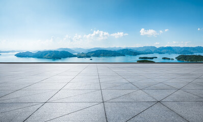 Empty square floor and beautiful lake with mountain natural landscape on a sunny day