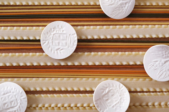 Uncooked italian durum wheat semolina pasta, colored spaghetti, mafalde and ligurian croxetti