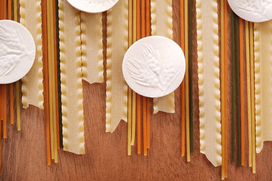 Uncooked italian durum wheat semolina pasta, colored spaghetti, mafalde and ligurian croxetti