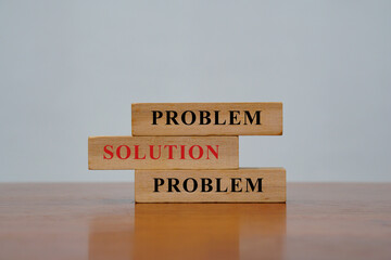 Wooden block with text, problem. Solutions to problems concept.