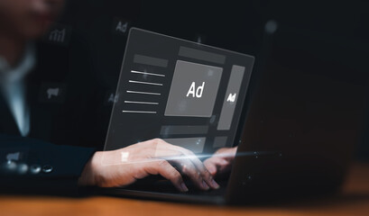 Digital marketing concept with businessman using computer laptop creating online adverts to...