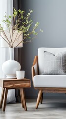 White ceramic lamp and wooden table with green plant in modern living room interior