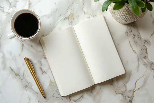 Elegant shot of white empty open book or planner mockup on a marble desk with cup of dark strong coffee and gold pen laying near, ready for time management, morning routine, starti