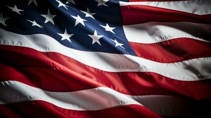 A waving American flag against a dark background