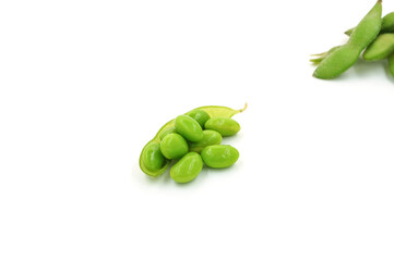 Fresh edamame soybeans and pods isolated on white background.