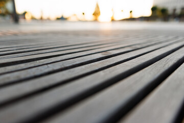 texture of a wooden street bench against the background of a summer park.