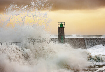 Impressive huge waves hitting the port of Viavelez in Asturias during a storm in the Cantabrian Sea