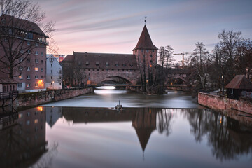 Sunset view of bridge and beautiful old buildings on the Pegnitz River in Nuremberg. Bavaria Region Middle Franconia, Germany