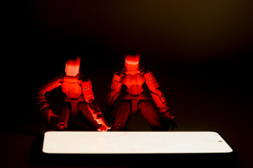 Concept photo of people's addiction to social networks. Figures of people with a telephone
