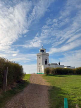 Sunny day and a white lighthouse at sight perfect for summer day on vacation