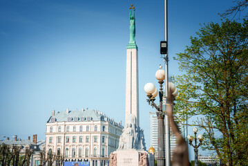 Naklejka premium A miniature bronze sculpture of the monument of freedom Milda in Riga, Latvia.