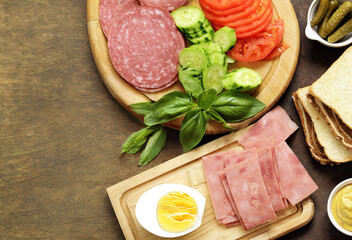 sandwich ingredients bread, ham, vegetables and sauce