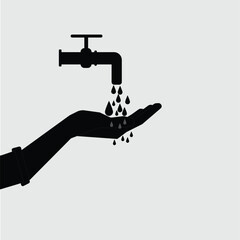 hand holds the water that comes down from the water tap
