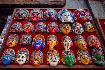 Traditional handcrafted masks and souvenirs for sale in street shop of Kathmandu, Nepal