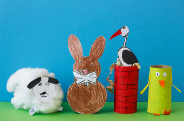 A sheep, a rabbit, a stork on a chimney and a chicken made by a child from a roll of toilet paper....