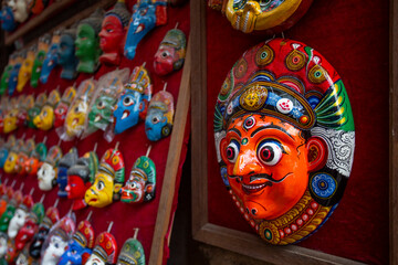 Traditional handcrafted masks and souvenirs for sale in street shop of Kathmandu, Nepal