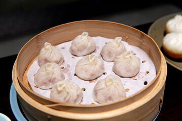 Steamed Xiaolongbao, Chinese Soup Dumplings, Served Fresh in a Bamboo Steamer
