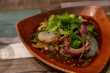 Traditional Goong Chae Nam Pla, Thai Raw Prawn Seafood Salad, with a Zesty Twist