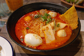Rich and Spicy Laksa Soup with Seafood, Egg, and Traditional Toppings