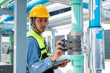 Engineer under industrial inspection Large water heaters are used in high-rise condominiums