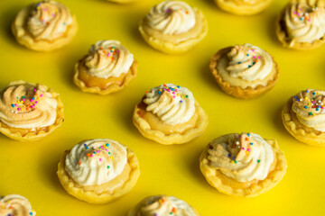 Group photo of mini lemon pies with cream.