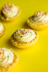 Group photo of mini lemon pies with cream.