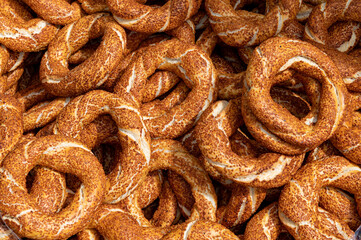 Bagels background. Close-up of traditional Turkish bagels known as simit. Simit or gevrek, traditional Turkish pastry food