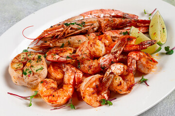 fried langoustines and tiger shrimps, with spices and herbs, homemade dish, without people,