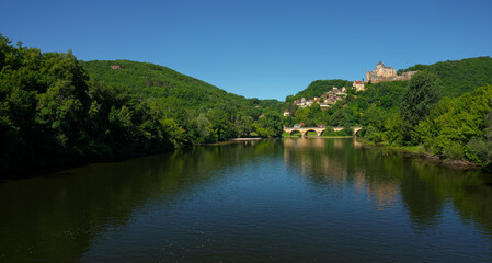 Chateau de Castelnaud wide view of the Dordogne river, blue sky in summer