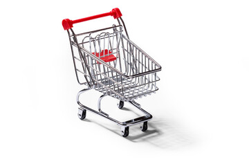 Empty grocery cart on clean white background with shadow.