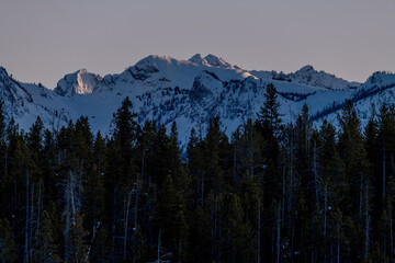 Last light of the day on snow covered mountain tops