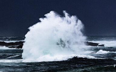waves crashing on the rocks