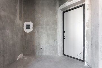 interior of the apartment without decoration in gray colors. rough finish