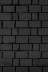 Old brick black wall. Abstract construction background.