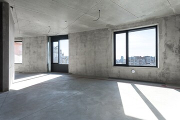 interior of the apartment without decoration in gray colors. rough finish