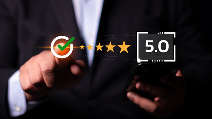Businessman using smartphone give rating to service experience on online application, 5-star...