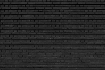 Old black brick wall. Abstract construction background.