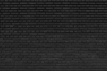 Old black brick wall. Abstract construction background.