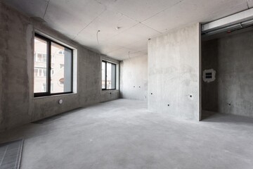 interior of the apartment without decoration in gray colors. rough finish
