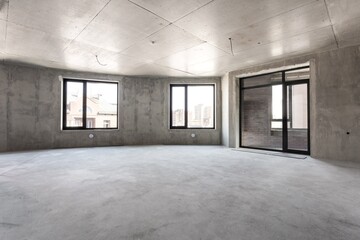 interior of the apartment without decoration in gray colors. rough finish