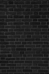 Old black brick wall. Abstract construction background.