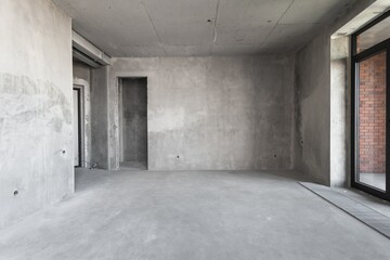 interior of the apartment without decoration in gray colors. rough finish