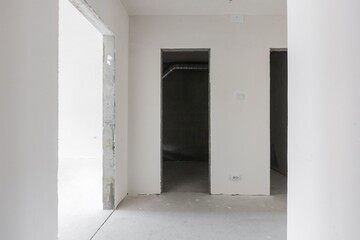 interior of the apartment without decoration in gray colors. rough finish