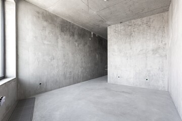 interior of the apartment without decoration in gray colors. rough finish