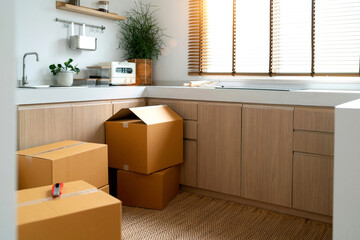 cardboard box storing new kitchen place. open and close packaging in kitchen room concept of...