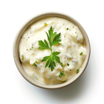 Top view of Delicious tartar sauce in bowl on white background