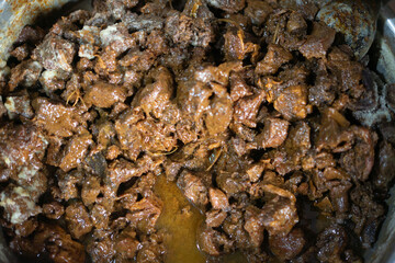 Fully cooked rendang simmering in a pot, ready to be served, showcasing the rich flavors of this traditional Indonesian dish.