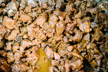Fully cooked rendang simmering in a pot, ready to be served, showcasing the rich flavors of this traditional Indonesian dish.