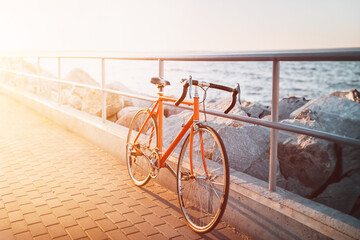 Orange Road Bicycle at the Seaside Sunset