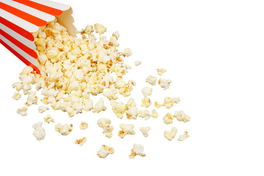 Salted popcorn spilling out of red and white cardboard box used as a border frame